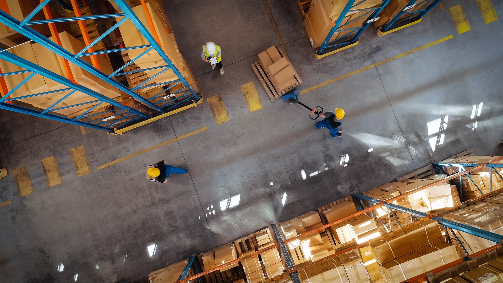 Top-Down View: In Warehouse People Working, Forklift Truck Operator Lifts Pallet with Cardboard Box. Logistics, Distribution Center with Products Ready for Global Shipment, Customer Delivery